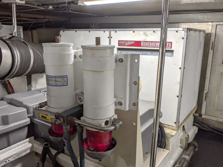 Pura Vida III Yacht Photos Pics Engine room of a 1999 Grand Alaskan Pilothouse with generator and fuel filters.