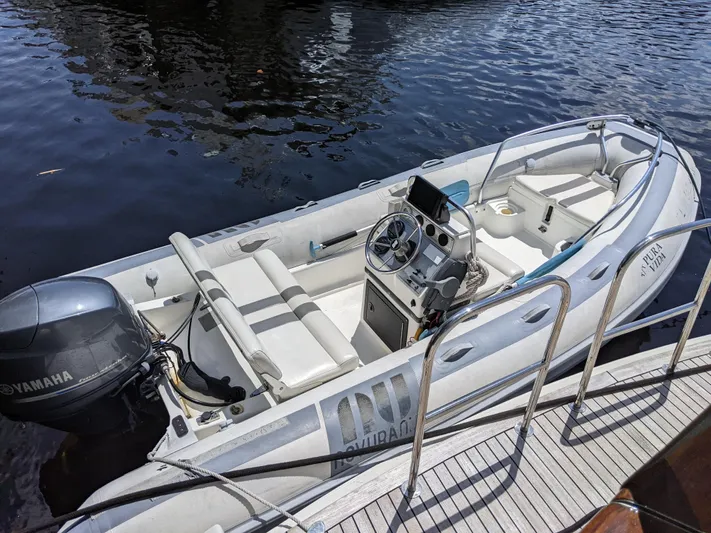 Pura Vida III Yacht Photos Pics 1999 Grand Alaskan Pilothouse boat with Yamaha outboard motor docked.