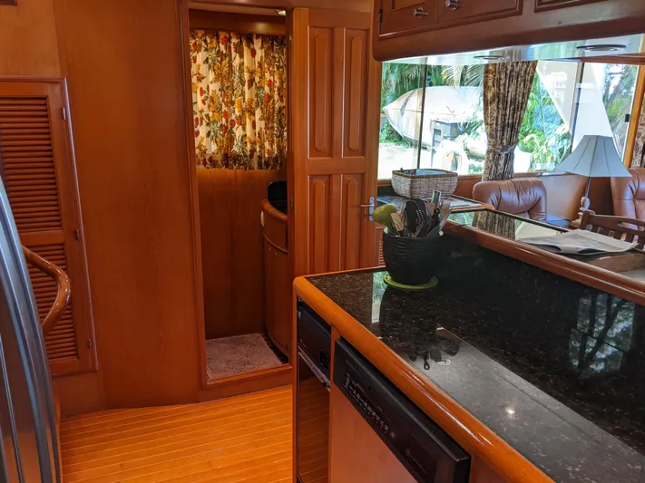 Pura Vida III Yacht Photos Pics 1999 Grand Alaskan Pilothouse interior with kitchen and living area.
