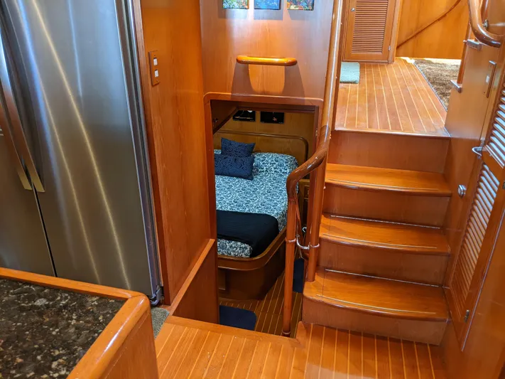 Pura Vida III Yacht Photos Pics 1999 Grand Alaskan Pilothouse interior with wooden stairs and cozy cabin.