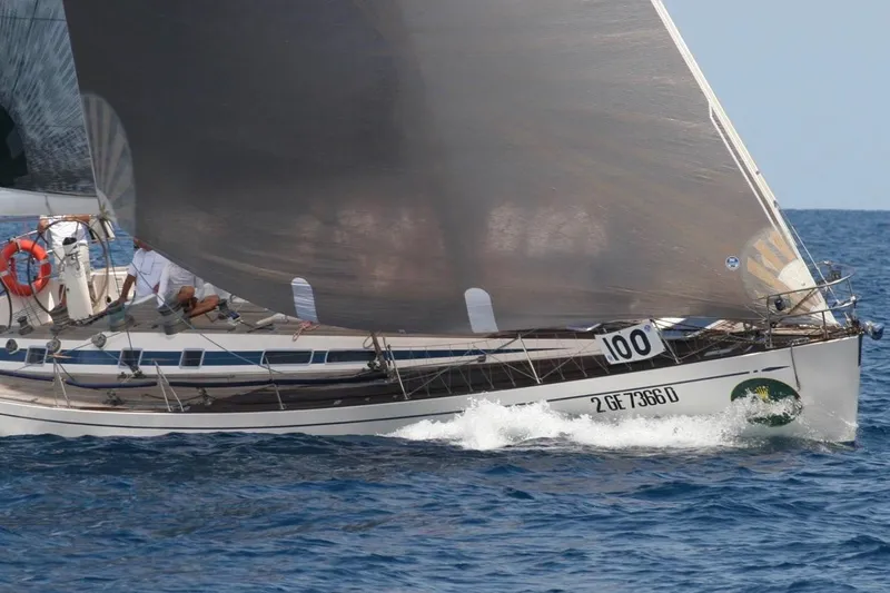 Vanish 2 Yacht Photos Pics Sailing yacht Nautor Swan 56, 1999 model, gliding on blue ocean waters.