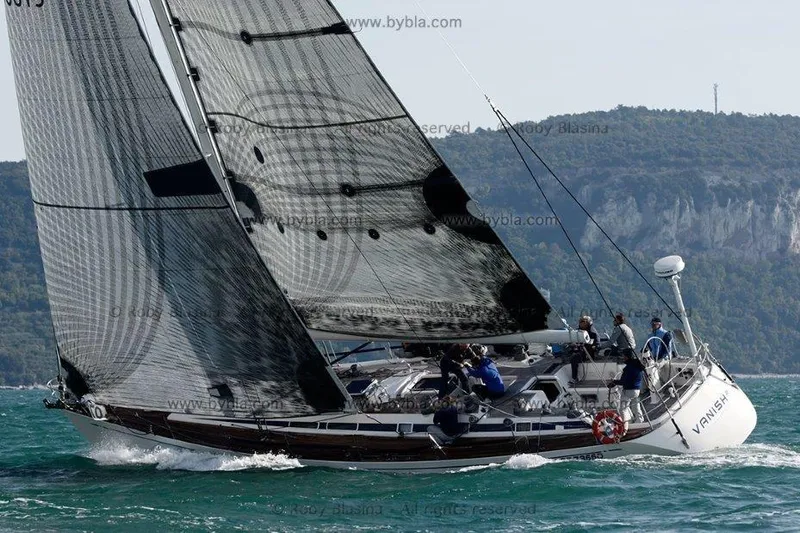 Vanish 2 Yacht Photos Pics Sailing yacht Nautor Swan 56, 1999 model, navigating coastal waters with crew onboard.