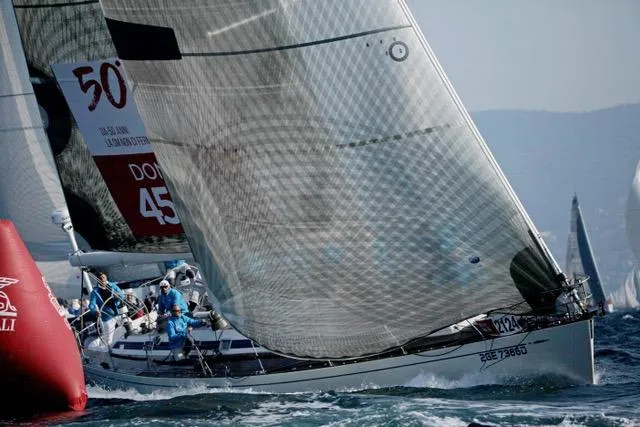 Vanish 2 Yacht Photos Pics Sailing yacht Nautor Swan 56, 1999 model, racing near buoy in open water.