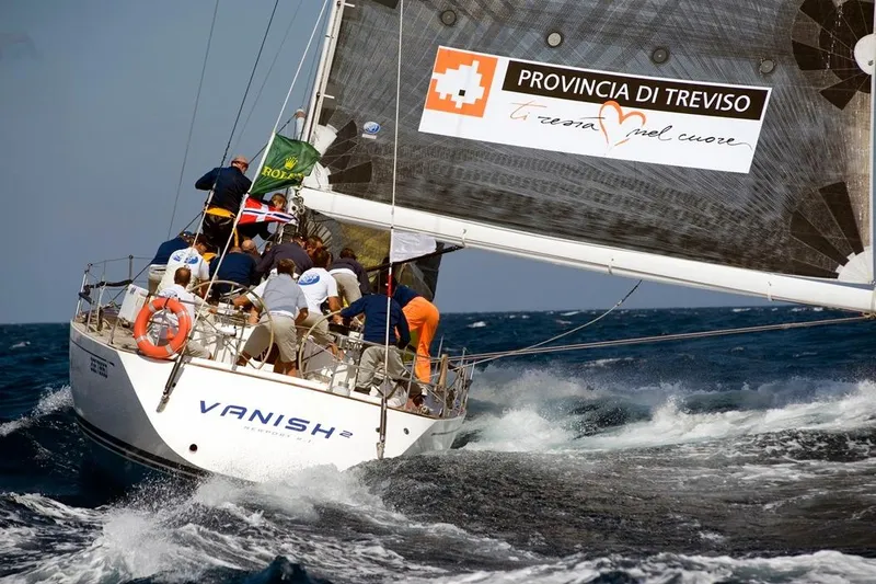 Vanish 2 Yacht Photos Pics Sailing yacht Nautor Swan 56, 1999, racing with crew on rough sea.