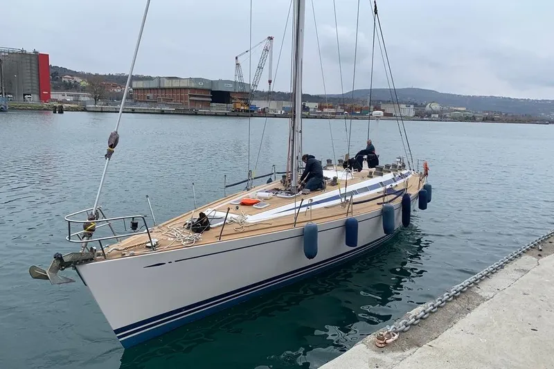 Vanish 2 Yacht Photos Pics Sailing yacht Nautor Swan 56, 1999 model, docked at a marina with crew onboard.
