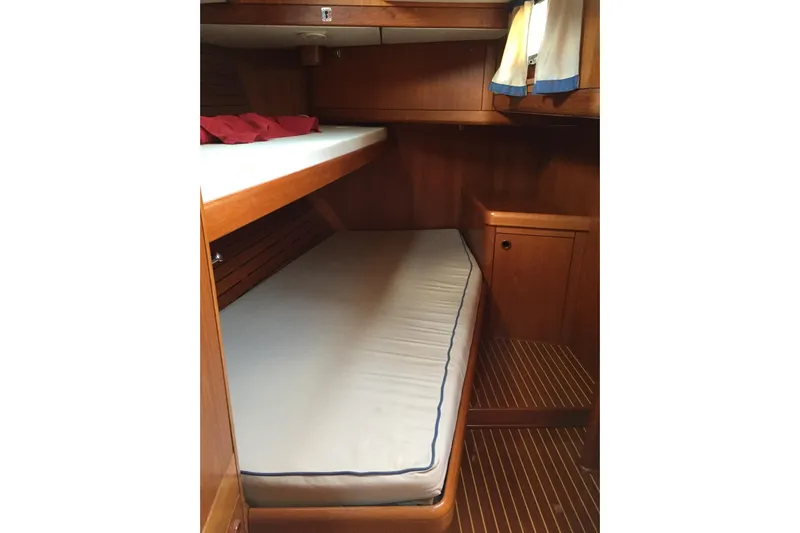 Vanish 2 Yacht Photos Pics Cabin interior of 1999 Nautor Swan 56 yacht with wooden bunk beds.