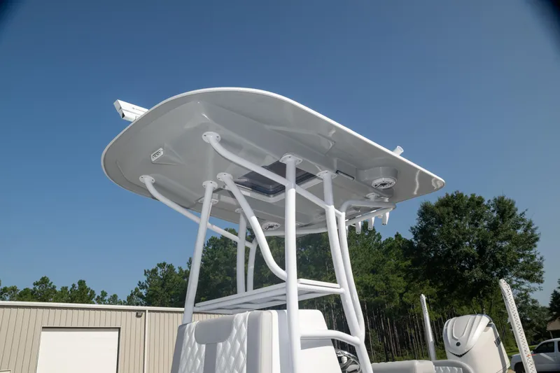  Yacht Photos Pics 2025 Contender 26 Bay boat with T-top against clear sky.