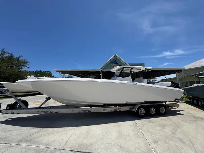  Yacht Photos Pics 2025 Fountain 38 TE boat on trailer under clear blue sky.