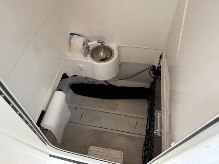  Yacht Photos Pics Interior of 2022 Aquasport 3000CC boat with sink and storage area.