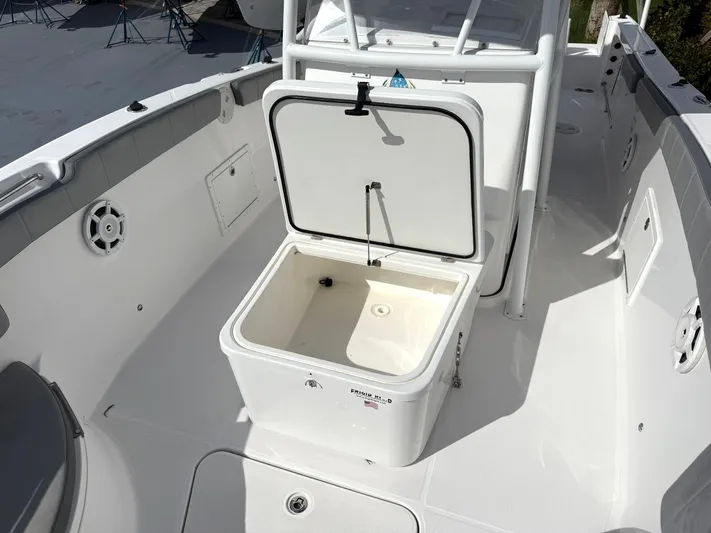  Yacht Photos Pics Open storage compartment on 2022 Aquasport 3000CC boat deck, showcasing spacious interior.