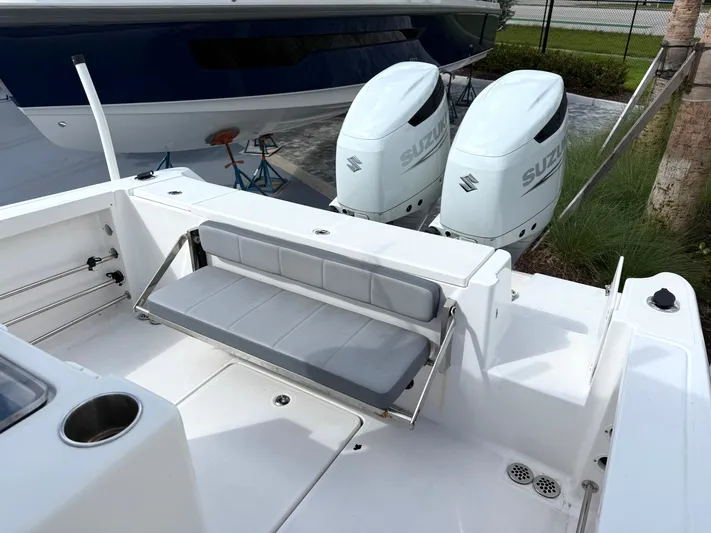  Yacht Photos Pics 2022 Aquasport 3000CC boat with dual Suzuki outboard engines and foldable seating.
