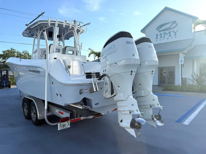  Yacht Photos Pics 2022 Aquasport 3000CC boat with dual Suzuki engines at HMY Yachts dealership.