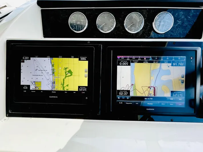 Anastasia Yacht Photos Pics Dashboard of 2010 Sea Ray 450 Sundancer with Garmin navigation displays.