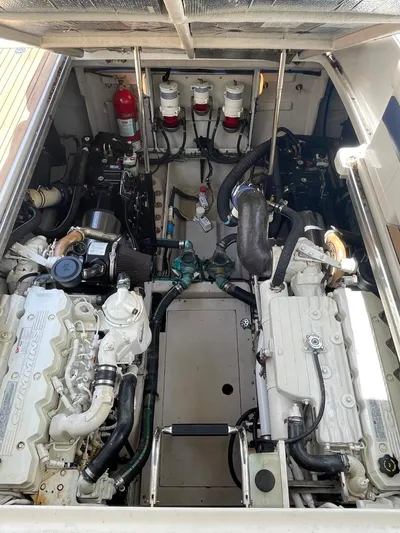 Anastasia Yacht Photos Pics Engine compartment of a 2010 Sea Ray 450 Sundancer, showcasing dual engines and mechanical components.