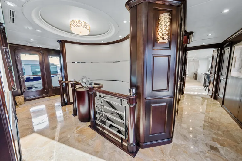 Nicole Evelyn Yacht Photos Pics Luxurious interior of 2005 Trinity Yachts Tri-Deck with elegant wood finishes and modern design.