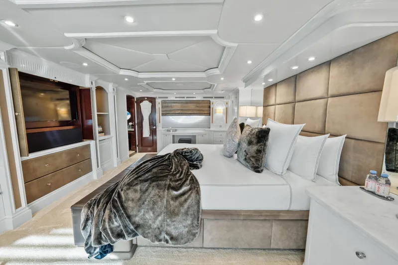 Nicole Evelyn Yacht Photos Pics Luxurious bedroom interior on 2005 Trinity Yachts Tri-Deck, featuring elegant decor and plush bedding.