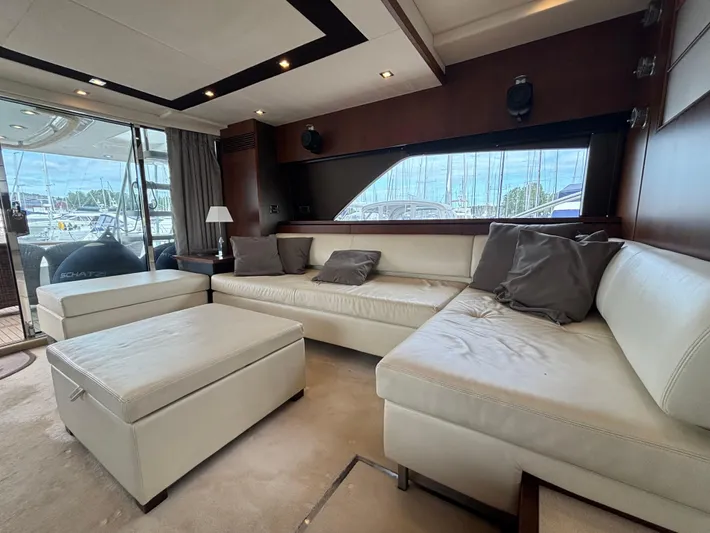 Schatzi Yacht Photos Pics Luxurious interior of 2013 Fairline Squadron 78 Custom yacht with white leather seating.