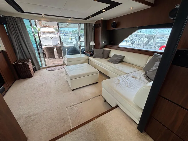 Schatzi Yacht Photos Pics Luxurious interior of 2013 Fairline Squadron 78 Custom yacht with plush seating and marina view.