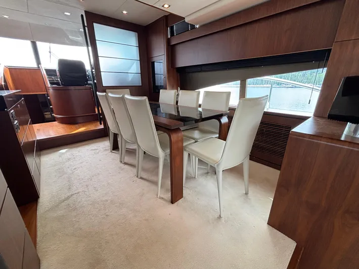 Schatzi Yacht Photos Pics Luxurious dining area on 2013 Fairline Squadron 78 Custom yacht with elegant wood finishes.