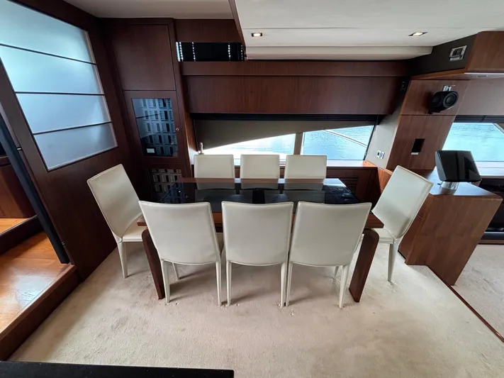 Schatzi Yacht Photos Pics Luxurious dining area on 2013 Fairline Squadron 78 Custom yacht with elegant seating.