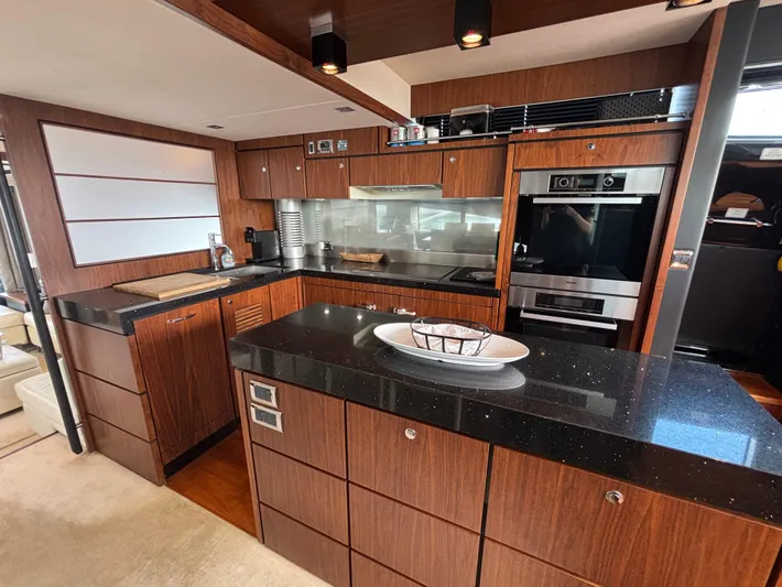 Schatzi Yacht Photos Pics Luxurious kitchen interior of 2013 Fairline Squadron 78 Custom yacht with modern appliances.