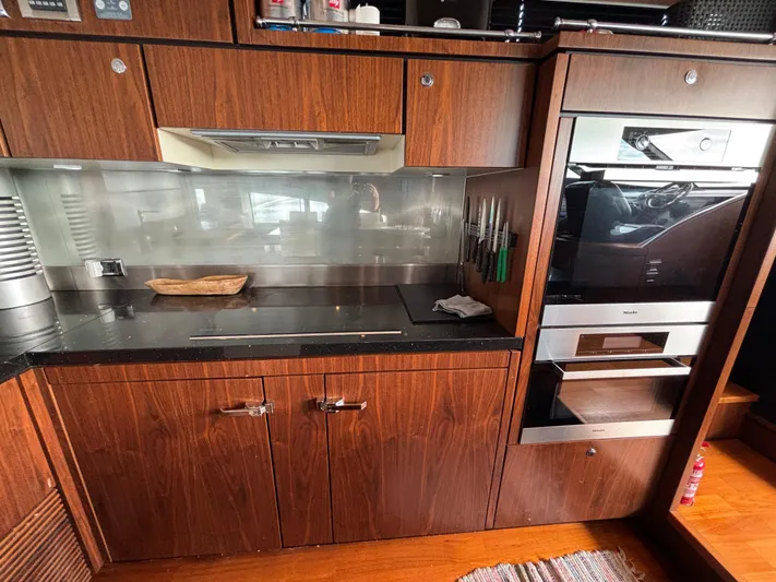 Schatzi Yacht Photos Pics Luxurious kitchen interior on 2013 Fairline Squadron 78 Custom yacht, featuring modern appliances.