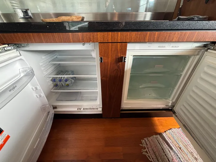Schatzi Yacht Photos Pics Open refrigerator and freezer in 2013 Fairline Squadron 78 Custom yacht kitchen.