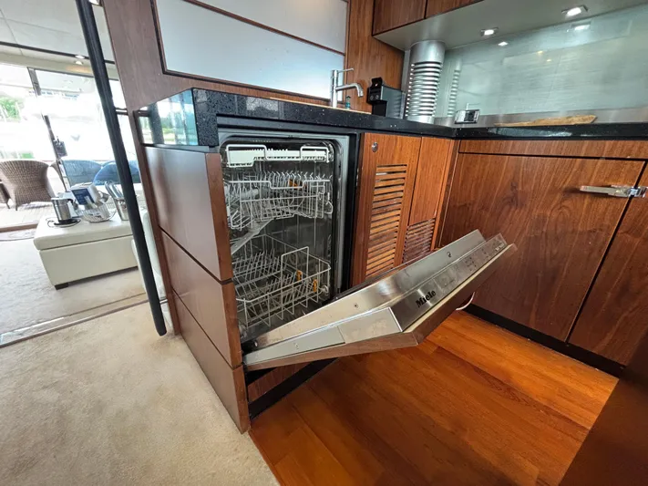 Schatzi Yacht Photos Pics Open dishwasher in luxurious Fairline Squadron 78 Custom yacht kitchen, 2013 model.