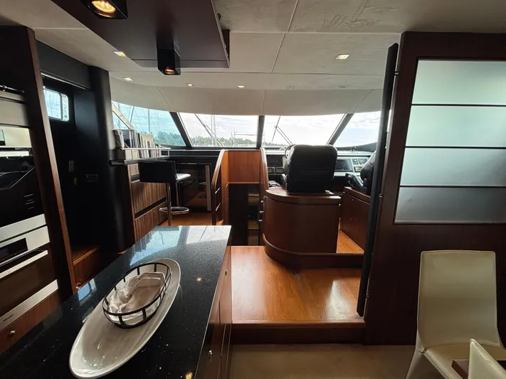 Schatzi Yacht Photos Pics Luxurious interior of 2013 Fairline Squadron 78 Custom yacht with modern design and helm station.