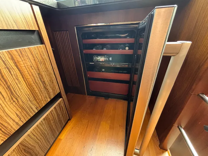 Schatzi Yacht Photos Pics Open wine cooler in 2013 Fairline Squadron 78 Custom yacht interior.