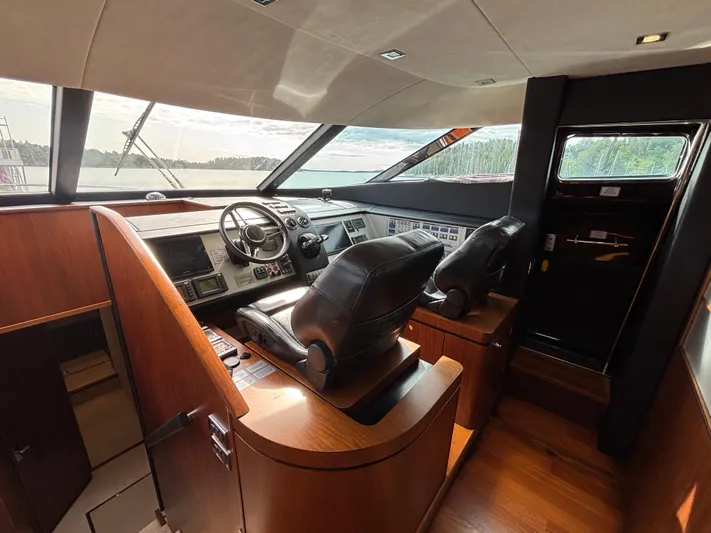 Schatzi Yacht Photos Pics Interior of 2013 Fairline Squadron 78 Custom yacht cockpit with leather seats and control panel.