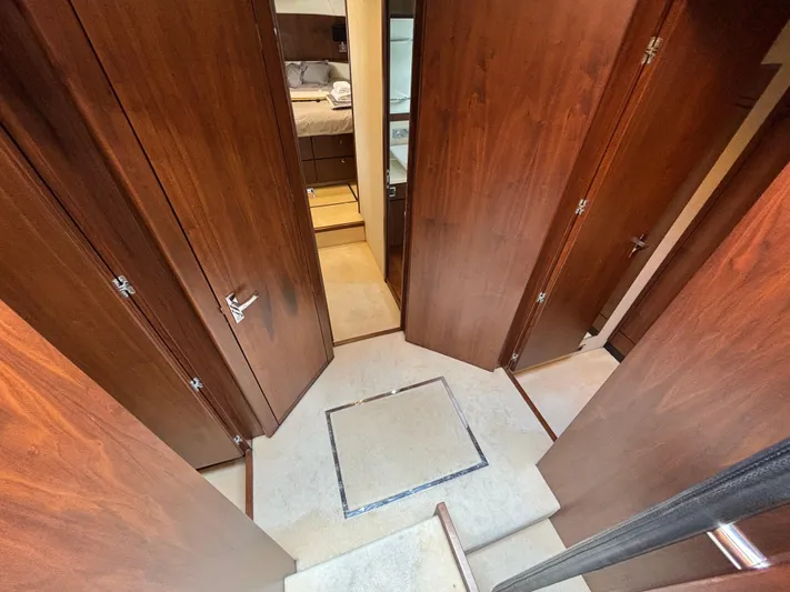 Schatzi Yacht Photos Pics Interior of 2013 Fairline Squadron 78 Custom yacht with wooden doors and carpeted floor.