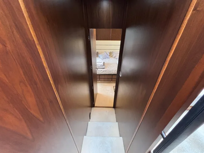 Schatzi Yacht Photos Pics Luxurious interior hallway of 2013 Fairline Squadron 78 Custom yacht, leading to a bedroom.