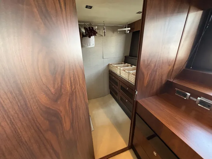 Schatzi Yacht Photos Pics Luxurious wooden interior of 2013 Fairline Squadron 78 Custom yacht with storage and hangers.