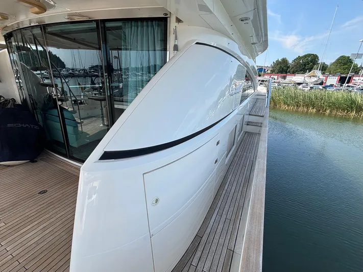 Schatzi Yacht Photos Pics 2013 Fairline Squadron 78 Custom yacht docked, showcasing sleek design and wooden deck.