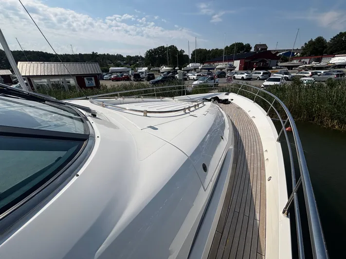 Schatzi Yacht Photos Pics Fairline Squadron 78 Custom yacht deck, 2013 model, docked at marina under clear sky.