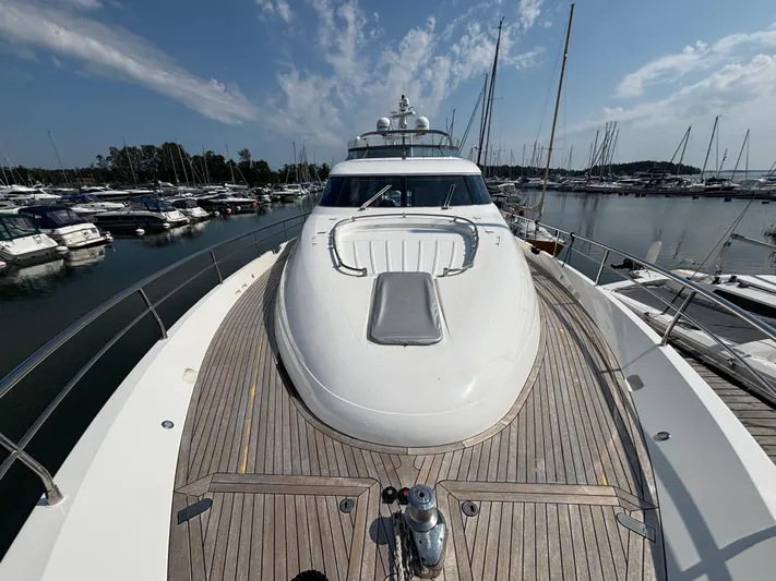 Schatzi Yacht Photos Pics 2013 Fairline Squadron 78 Custom yacht docked at marina under clear sky.