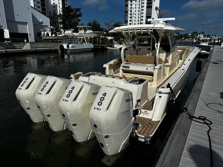  Yacht Photos Pics 2025 Scout 400 LXF boat docked with four powerful Mercury 400 V10 engines.
