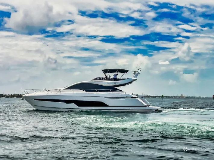  Yacht Photos Pics 2023 Fairline Phantom 65 yacht cruising on open water.