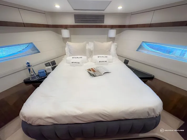  Yacht Photos Pics Luxurious bedroom in 2023 Fairline Phantom 65 yacht with modern decor.