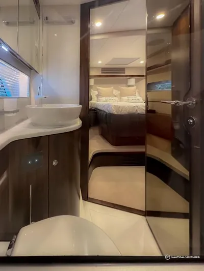  Yacht Photos Pics Luxurious bathroom and bedroom interior of the 2023 Fairline Phantom 65 yacht.