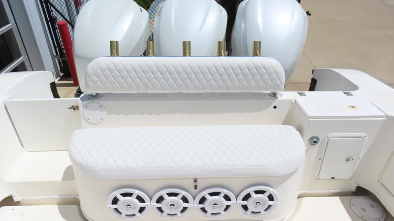  Yacht Photos Pics 2002 Fountain 38 TE boat with white seating and multiple outboard engines.