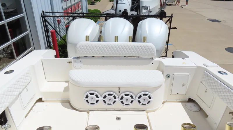  Yacht Photos Pics 2002 Fountain 38 TE boat with quad outboard engines and white seating.