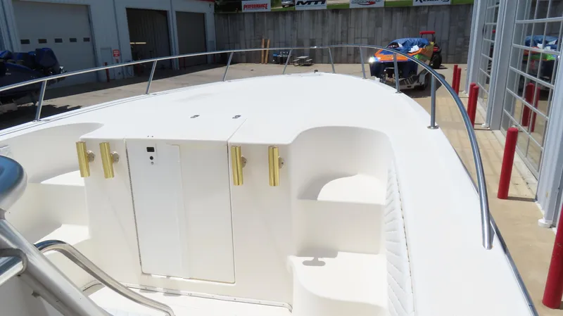  Yacht Photos Pics 2002 Fountain 38 TE boat deck with storage compartments and railing.