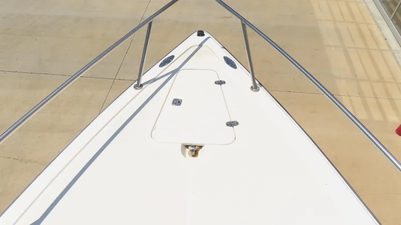  Yacht Photos Pics Bow of 2002 Fountain 38 TE boat with stainless steel railings.