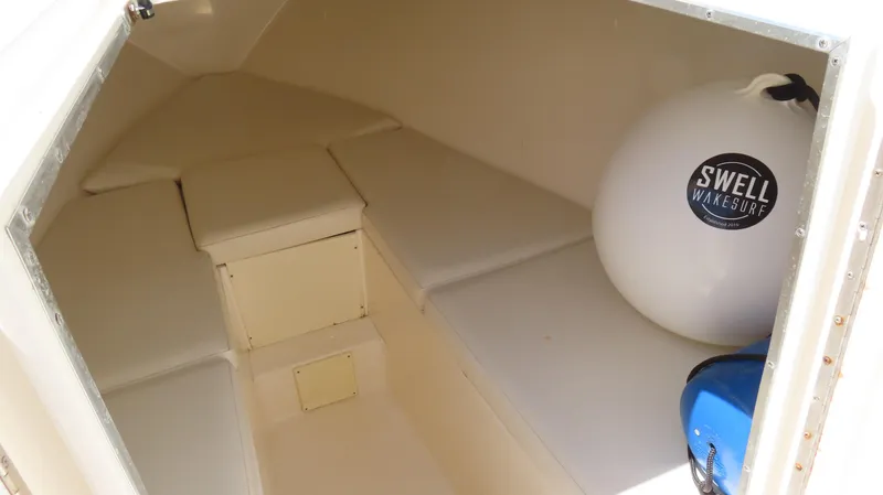  Yacht Photos Pics Interior cabin of 2002 Fountain 38 TE boat with seating and storage.