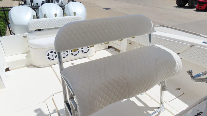  Yacht Photos Pics 2002 Fountain 38 TE boat interior with white cushioned seating and multiple outboard engines.