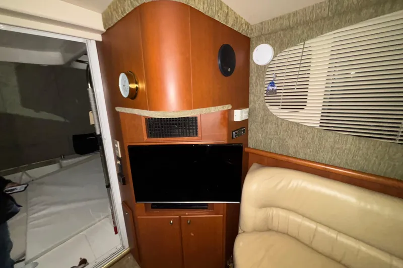  Yacht Photos Pics Interior of 2005 Silverton 34 Convertible yacht with TV and seating area.