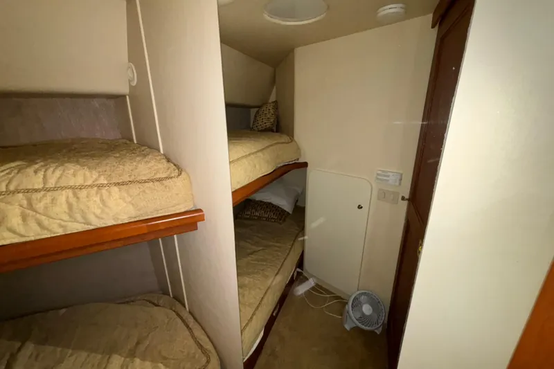  Yacht Photos Pics 2005 Silverton 34 Convertible cabin with bunk beds and compact fan.