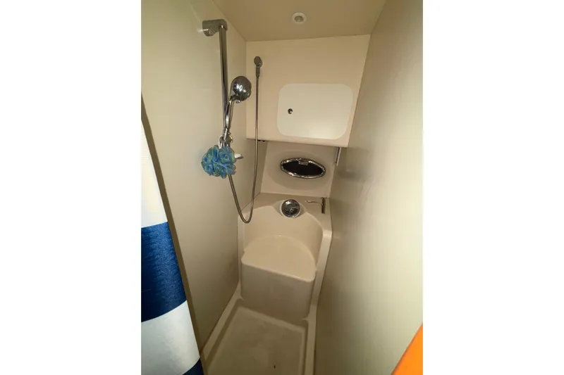  Yacht Photos Pics Compact shower area in a 2005 Silverton 34 Convertible boat.